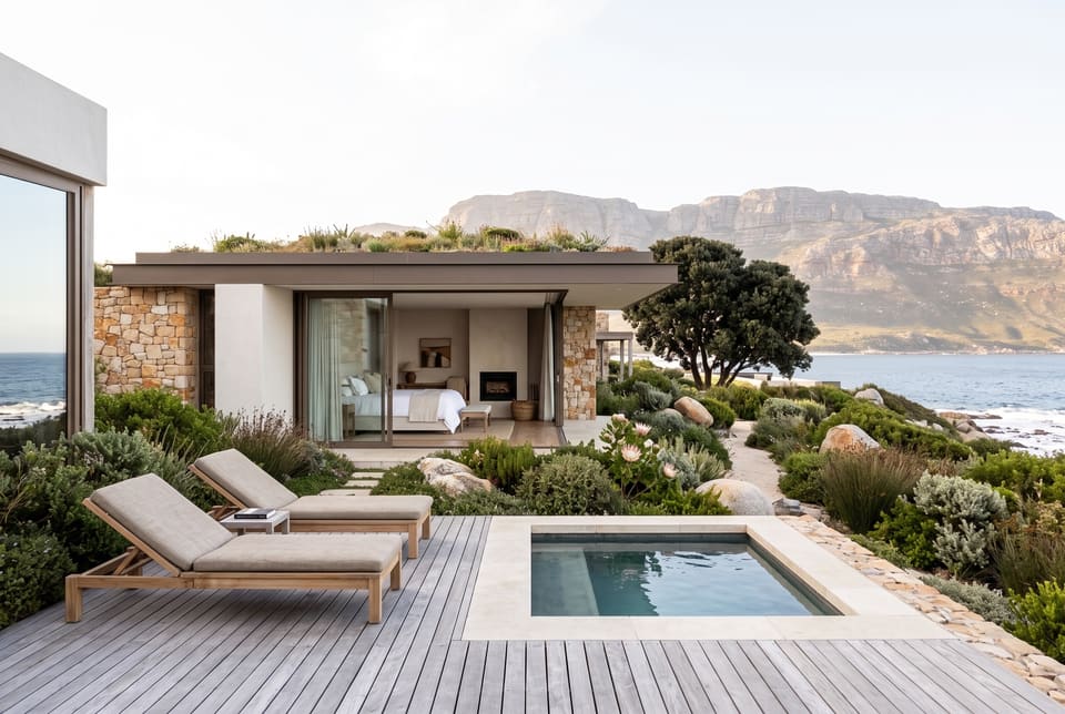 A guest villa with its own deck, plunge pool and loungers, the bedroom open to the fynbos and the sea